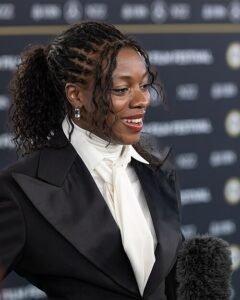 To understand the film’s conclusion, we must first appreciate the world DaCosta has built. Hedda, a Black woman of dubious social standing whose only true currency is her late General father's reputation and her new husband George Tesman’s (Tom Bateman) academic ambitions, is trapped. Her massive, gorgeously appointed country home is less a sanctuary and more a gilded cage, purchased for a life she neither wants nor can truly afford. Her marriage to George is a pragmatic solution to a social problem—a loss of freedom for a tenuous financial and racial security in a stifling, white, patriarchal society. This emotional suffocation, compounded by the return of her former lover and academic rival, Eileen Lovborg (Nina Hoss), a lesbian academic who embodies the defiant intellectual and sexual freedom Hedda craves but fears, sets the stage for disaster.3 Hedda's game of power and manipulation throughout the party is not born of mere malice, but of a deep, existential dread—a desperate attempt to prove she is still alive by controlling the lives of others.