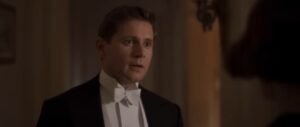 Tom Branson listens to Lucy. 